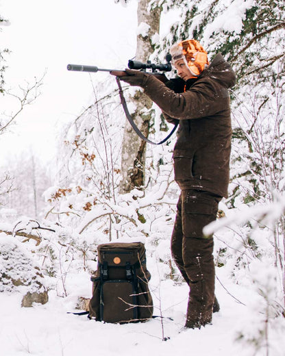 Suede Brown Coloured Pinewood Mens Smaland Abisko 2.0 Hunting Jacket on snow background 