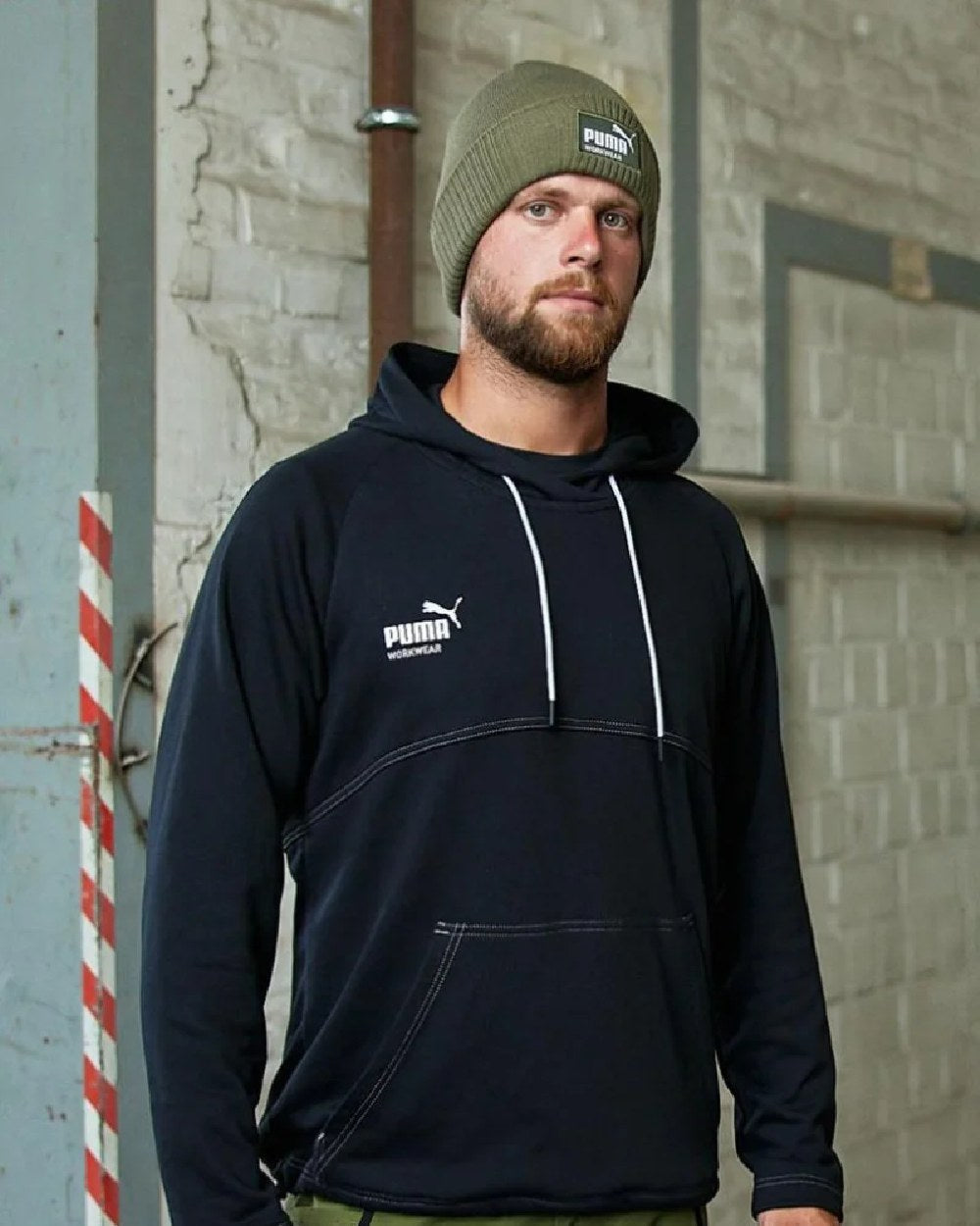 Olive Coloured Puma Workwear Beanie on outdoor background 