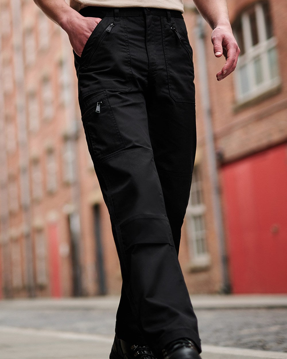 Black coloured Regatta Pro Action Trousers on blurry background 