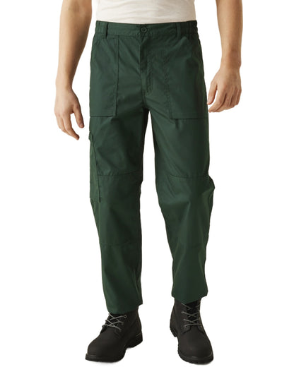 Green coloured Regatta Mens Multi Pocket Action Trousers Short Leg on white background 