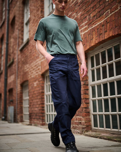 Navy coloured Regatta Mens Multi Pocket Action Trousers Short Leg on street background 