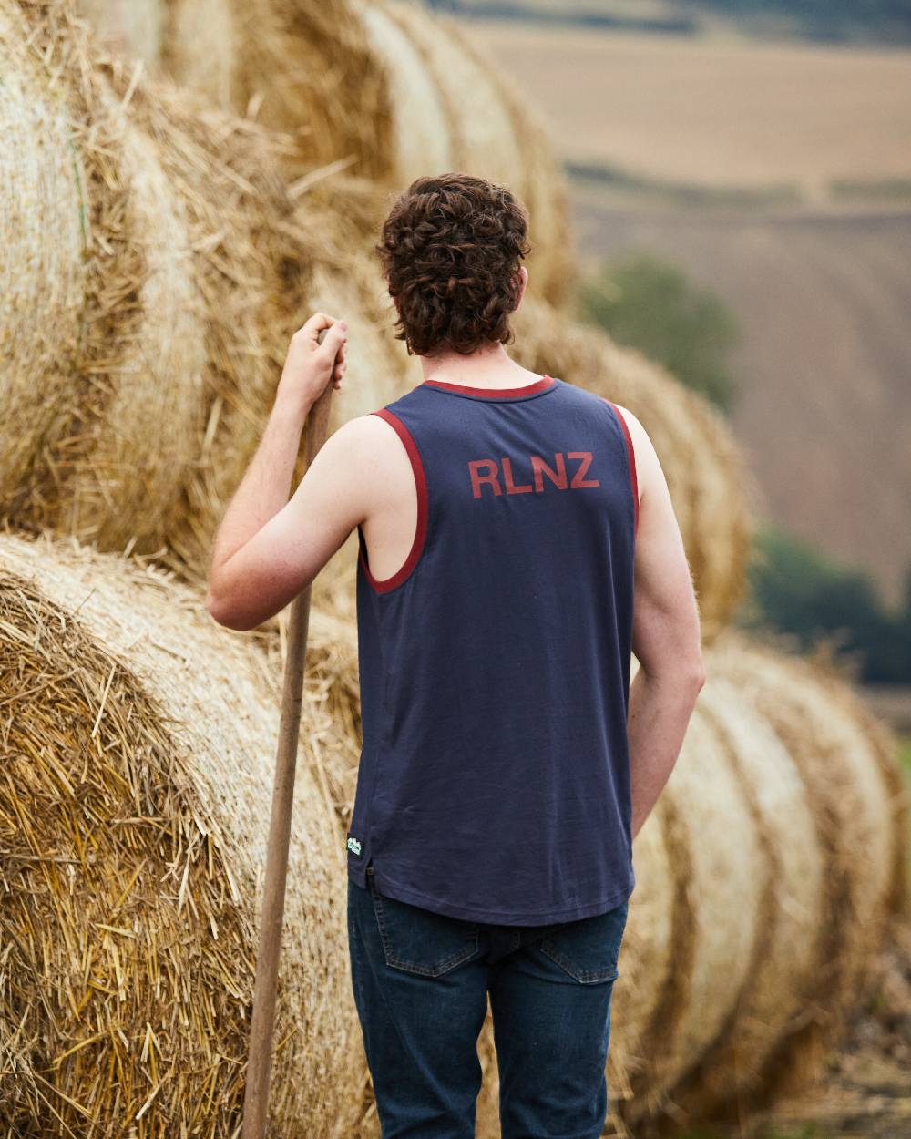 Navy Multi coloured Ridgeline Backslider Singlet Top on haystack background 