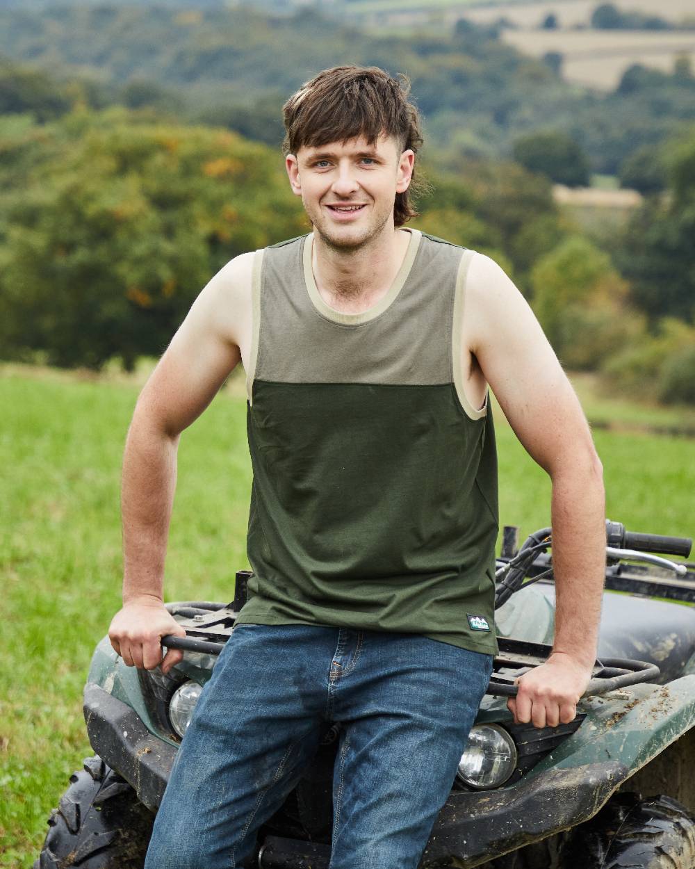 Olive Multi coloured Ridgeline Backslider Singlet Top on forest background 