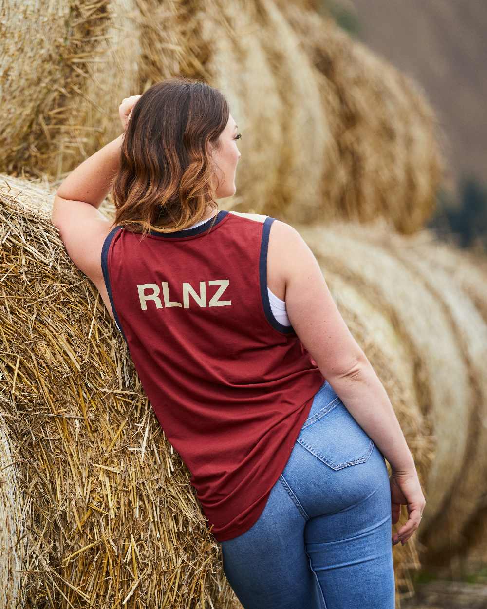 Rhubarb Multi coloured Ridgeline Backslider Singlet Top on haystack background 