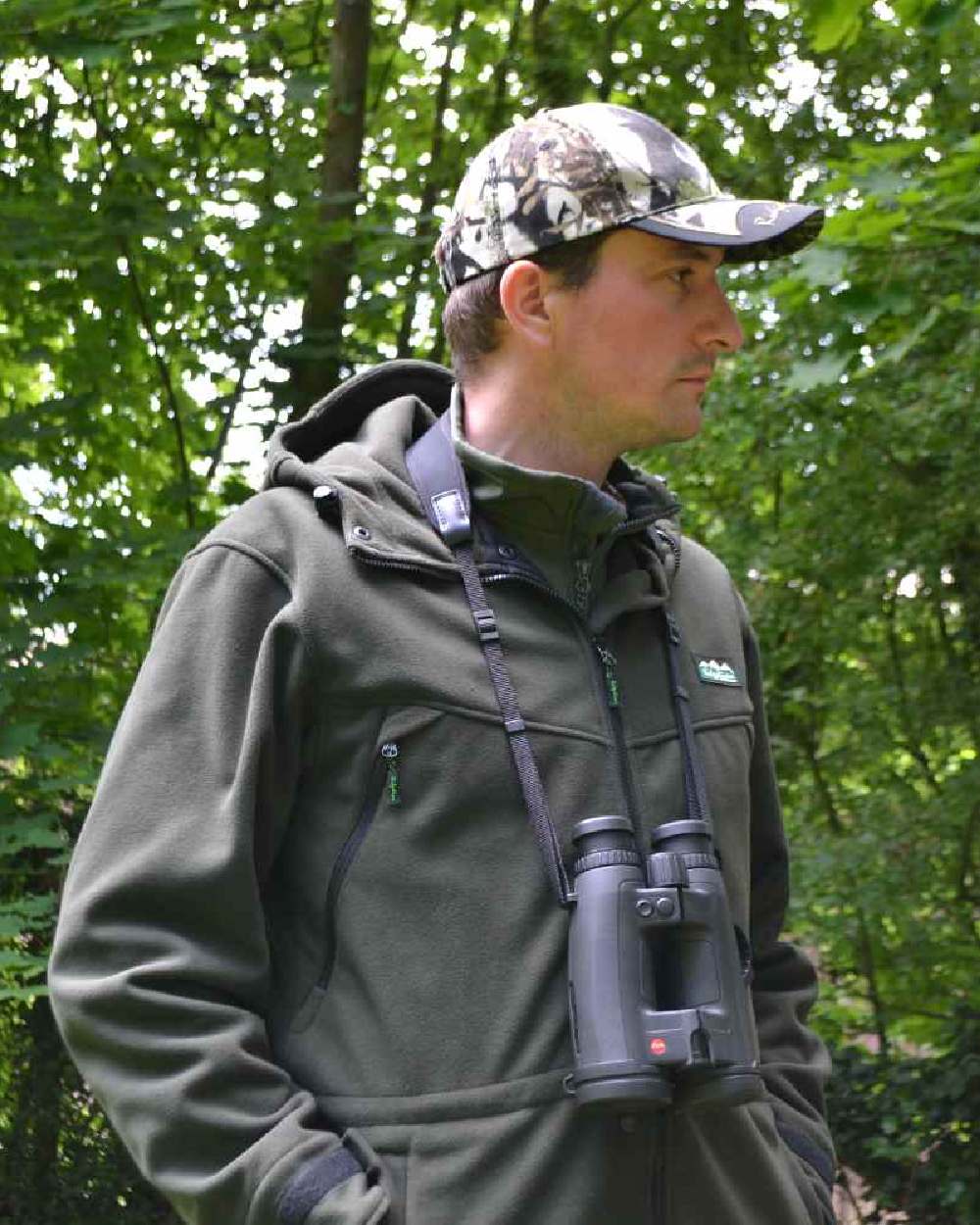 Olive Ridgeline Grizzly III Jacket on blurry green background 