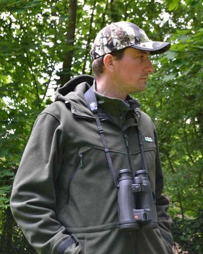 Olive Ridgeline Grizzly III Jacket on blurry green background 