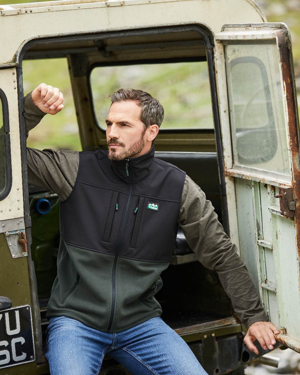 Deep Forest Black Coloured Ridgeline Hybrid Fleece Gilet on outdoor background