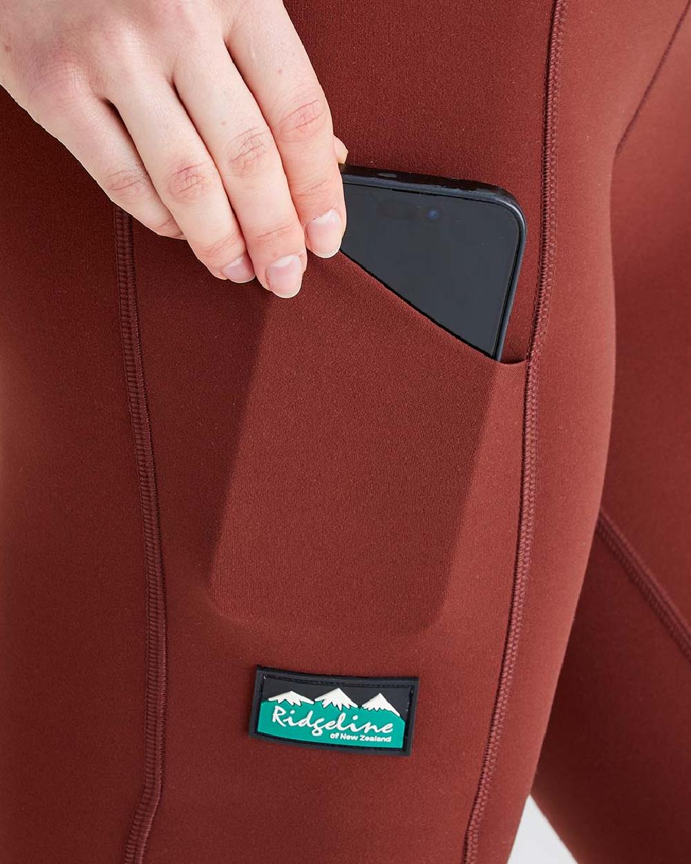 Oxblood coloured Ridgeline Ladies Infinity Leggings on grey background 