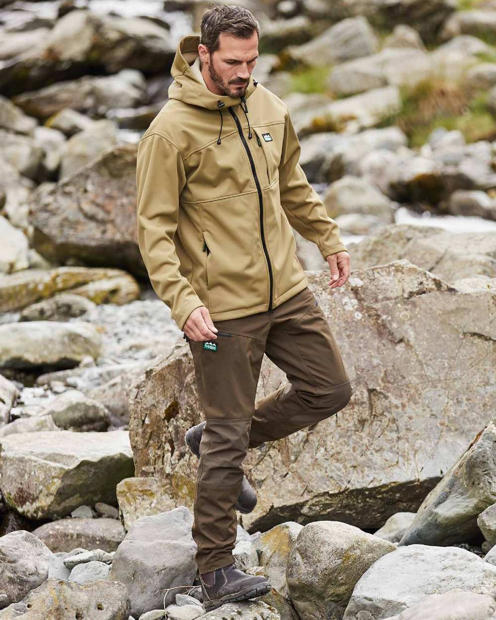 Faded Teak coloured Ridgeline Mens Gradient Jacket on rock background 