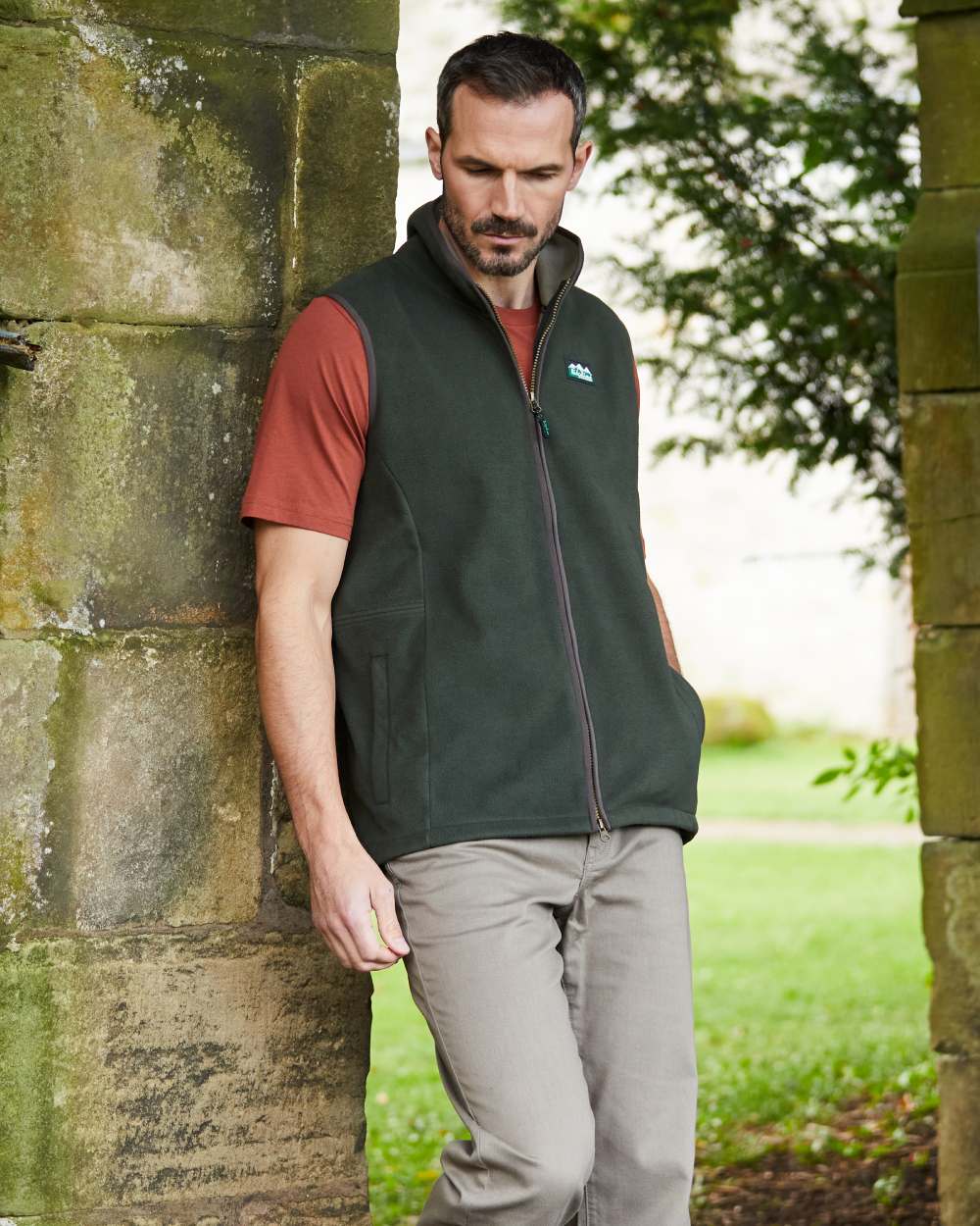 Deep Forest Coloured Ridgeline Mens Kodiak Gilet on hilly background 