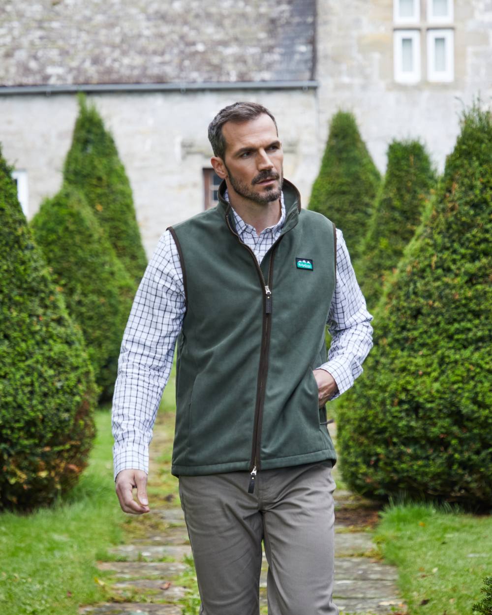 Deep Forest coloured Ridgeline Mens Monarch Gilet on lawn background 