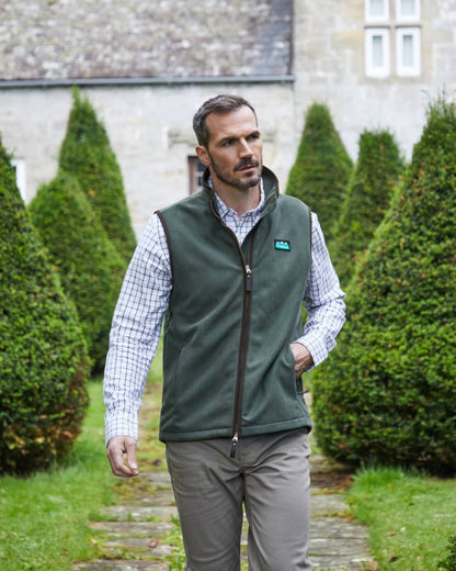 Deep Forest coloured Ridgeline Mens Monarch Gilet on lawn background 