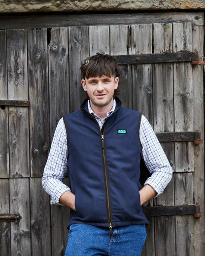 Navy coloured Ridgeline Mens Monarch Gilet on door background 
