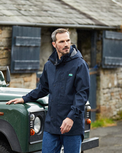 Navy Marl coloured Ridgeline Mens Monsoon Light Jacket on house background 