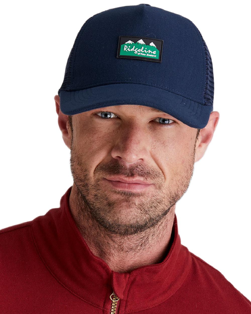 Navy Coloured Ridgeline Monsoon Trucker Cap on white background  