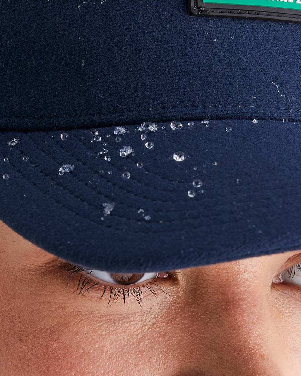 Navy Coloured Ridgeline Monsoon Trucker Cap on white background  