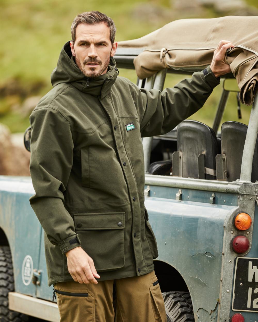 Deep Forest coloured Ridgeline Torrent III Waterproof Jacket on vehicle background 