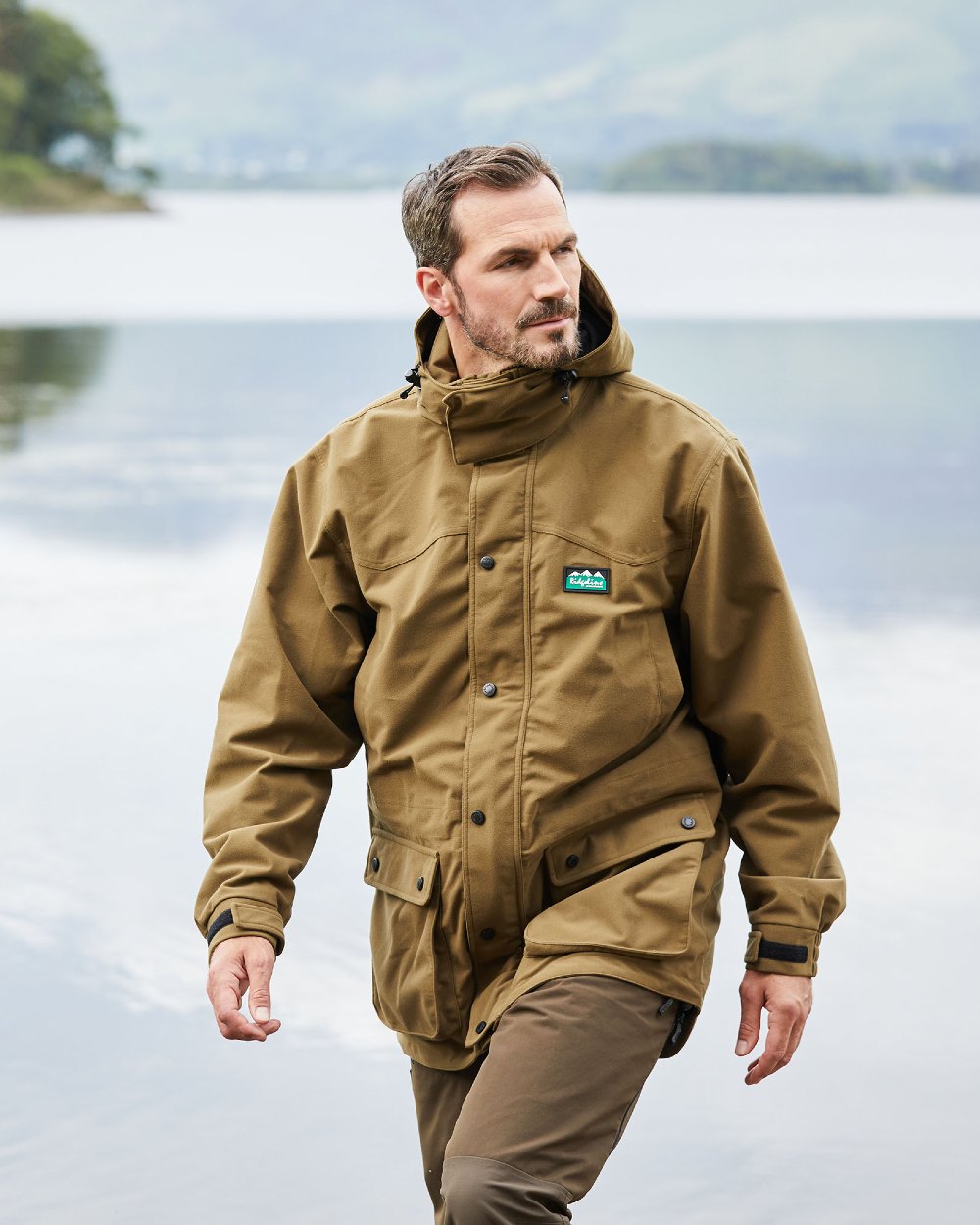 Teak coloured Ridgeline Torrent III Waterproof Jacket on blurry background 