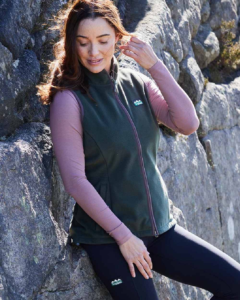 Deep Forest coloured Ridgeline Womens Kodiak Gilet on mountain background 