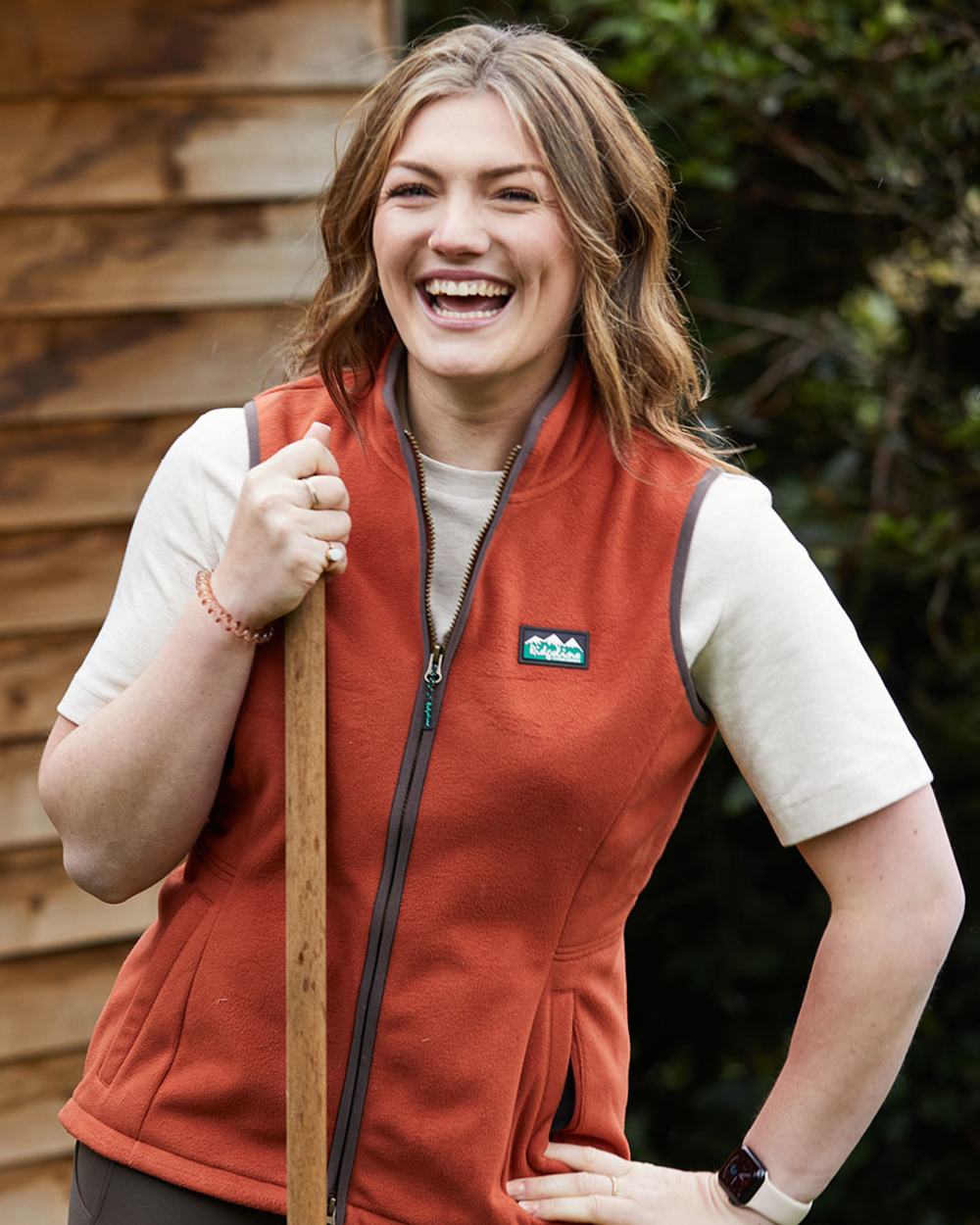 Russet coloured Ridgeline Womens Kodiak Gilet on tree background 