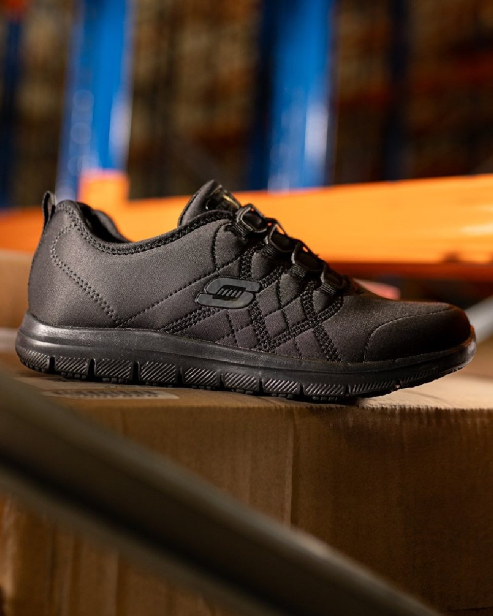 Black Coloured Skechers Workwear Womens Ghenter Srelt Safety Shoes on indoor background 