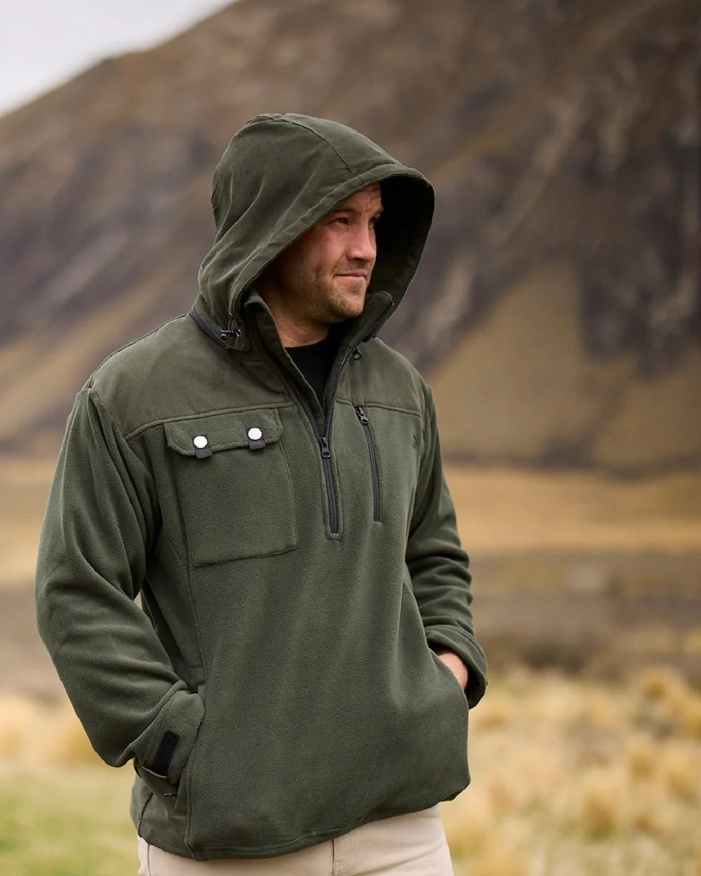 Olive Coloured Swanndri Mens High Rock Technical Fleece Hoodie on mountain background 