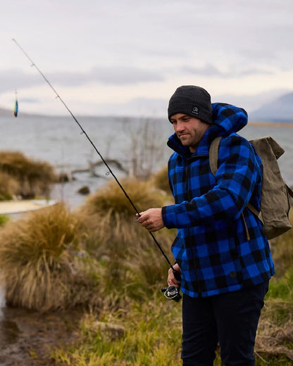 Blue Black Check Coloured Swanndri Mens Hudson Wool Hoodie on sea background 