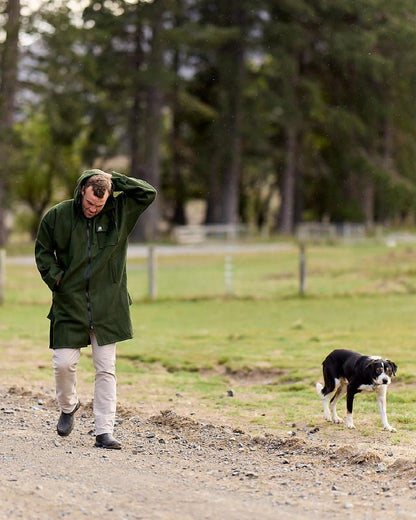 Olive Coloured Swanndri Mens Mosgiel Wool Bushshirt with Zip-up Front on garden background 