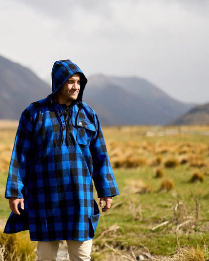 Blue Black Check Coloured Swanndri Mens Original Wool Bushshirt With Lace-Up Front on mountain background 