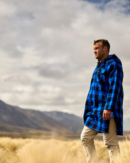 Blue Black Check Coloured Swanndri Mens Original Wool Bushshirt With Lace-Up Front on mountain background 