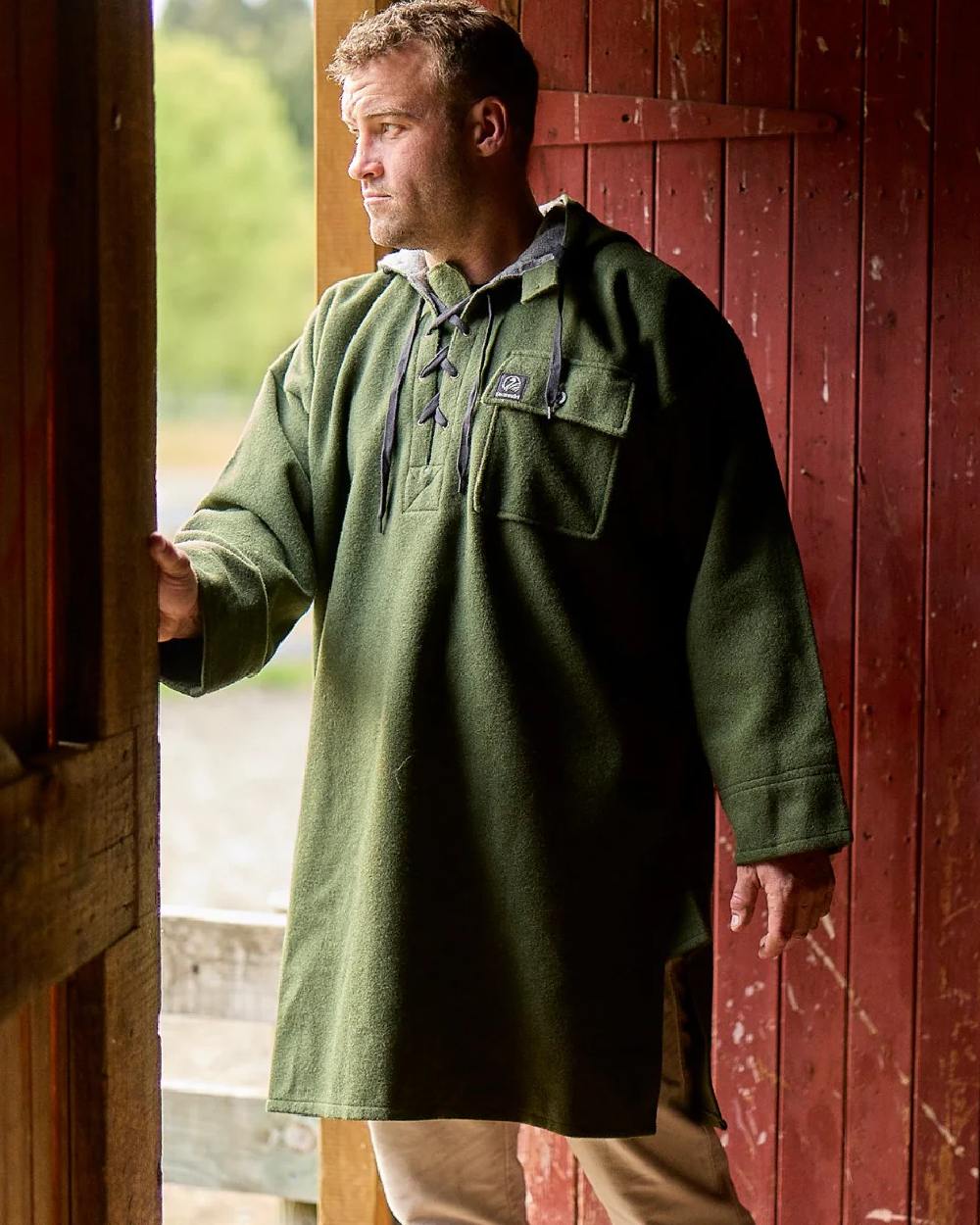 Olive Coloured Swanndri Mens Original Wool Bushshirt With Lace-Up Front on door background 