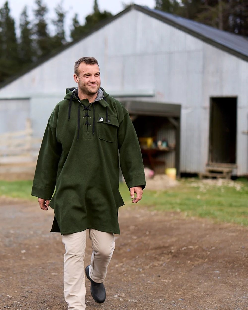 Olive Coloured Swanndri Mens Original Wool Bushshirt With Lace-Up Front on house background 