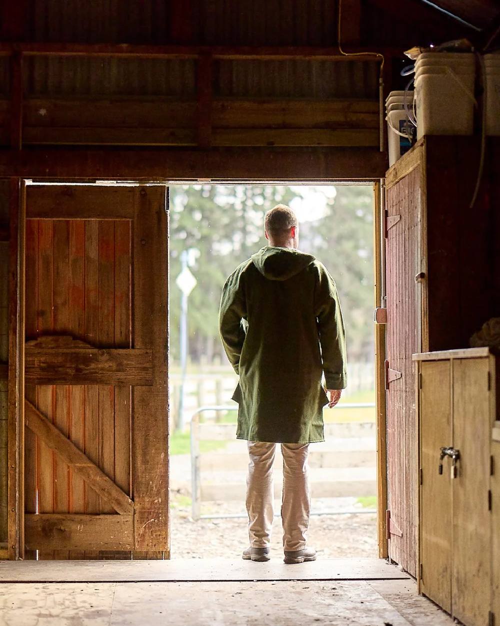 Olive Coloured Swanndri Mens Original Wool Bushshirt With Lace-Up Front on door background 