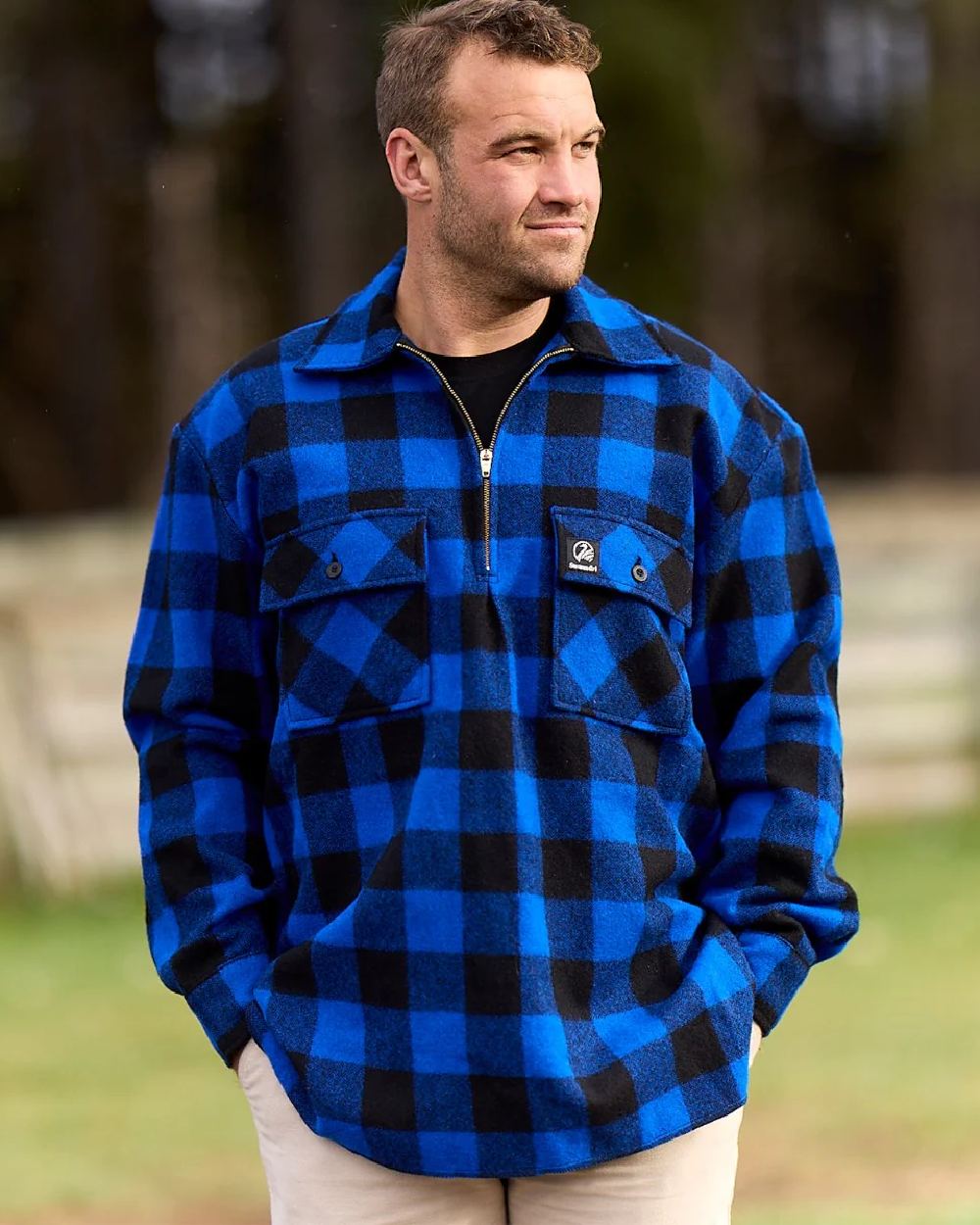 Blue Black Check Coloured Swanndri Mens Ranger Wool Zip Front Bushshirt on blurry background 