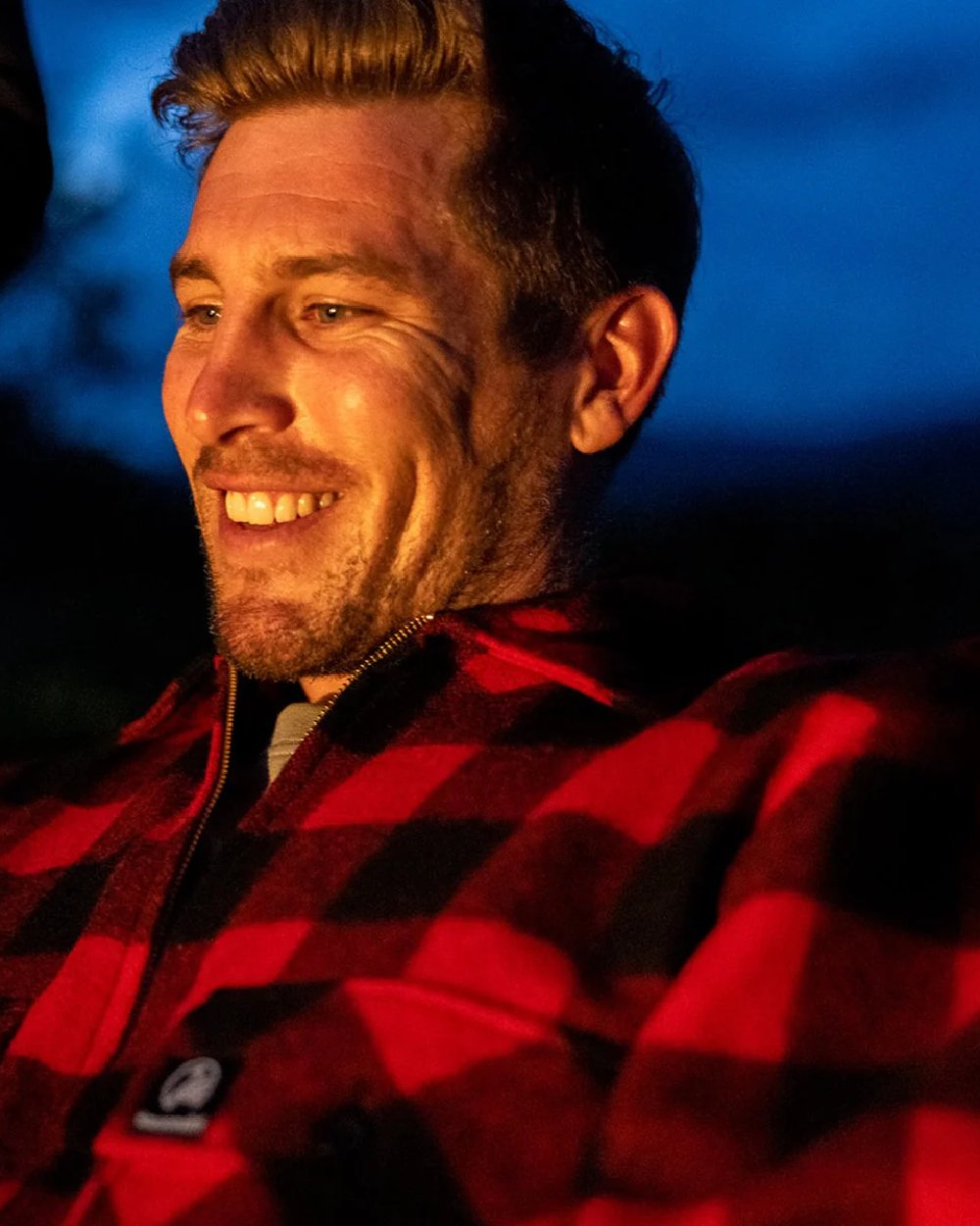 Red Black Check Coloured Swanndri Mens Ranger Wool Zip Front Bushshirt on blurry background 