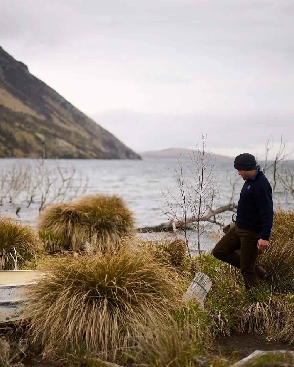 Navy Coloured Swanndri Mens Rhino Stormshield Wool Jersey with Windproof Lining on coastal background 