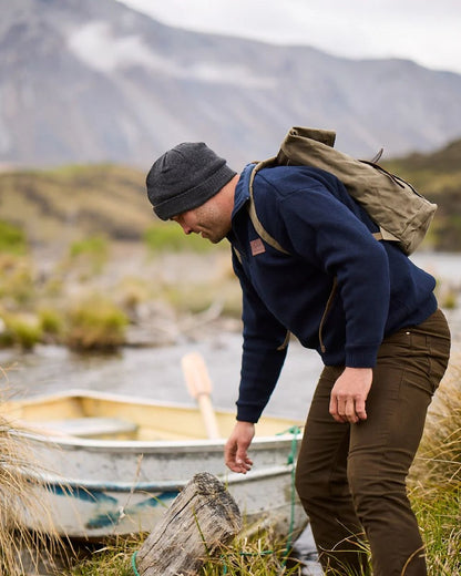 Navy Coloured Swanndri Mens Rhino Stormshield Wool Jersey with Windproof Lining on mountain background 