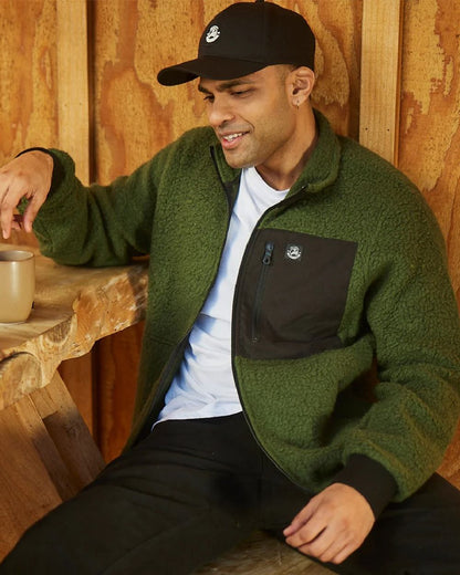 Black Coloured Swanndri Swanni Baseball Cap on cafe  background 