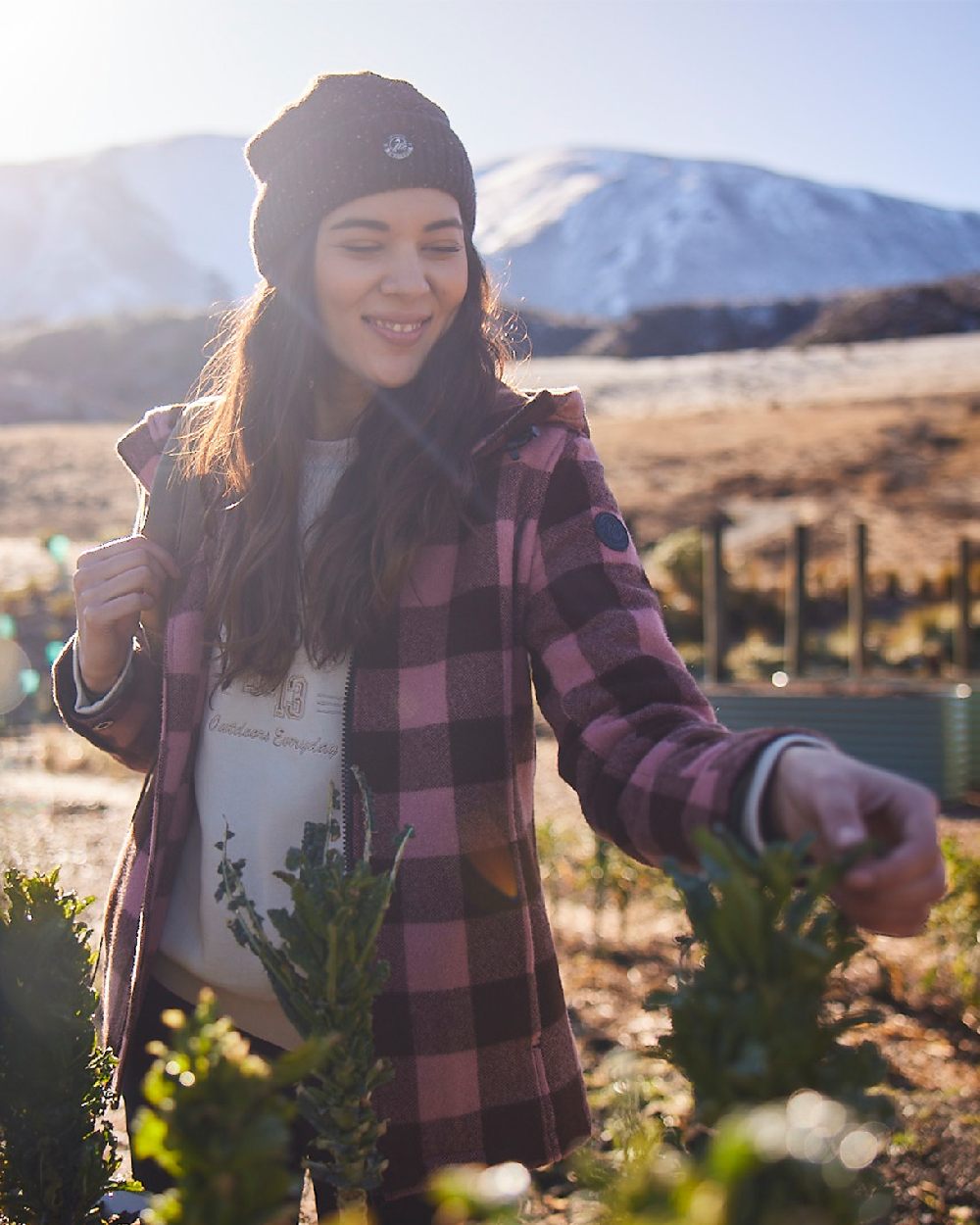 Rose Coffee Check Coloured Swanndri Womens Seattle V2 Wool Hooded Sweater on outdoor background 