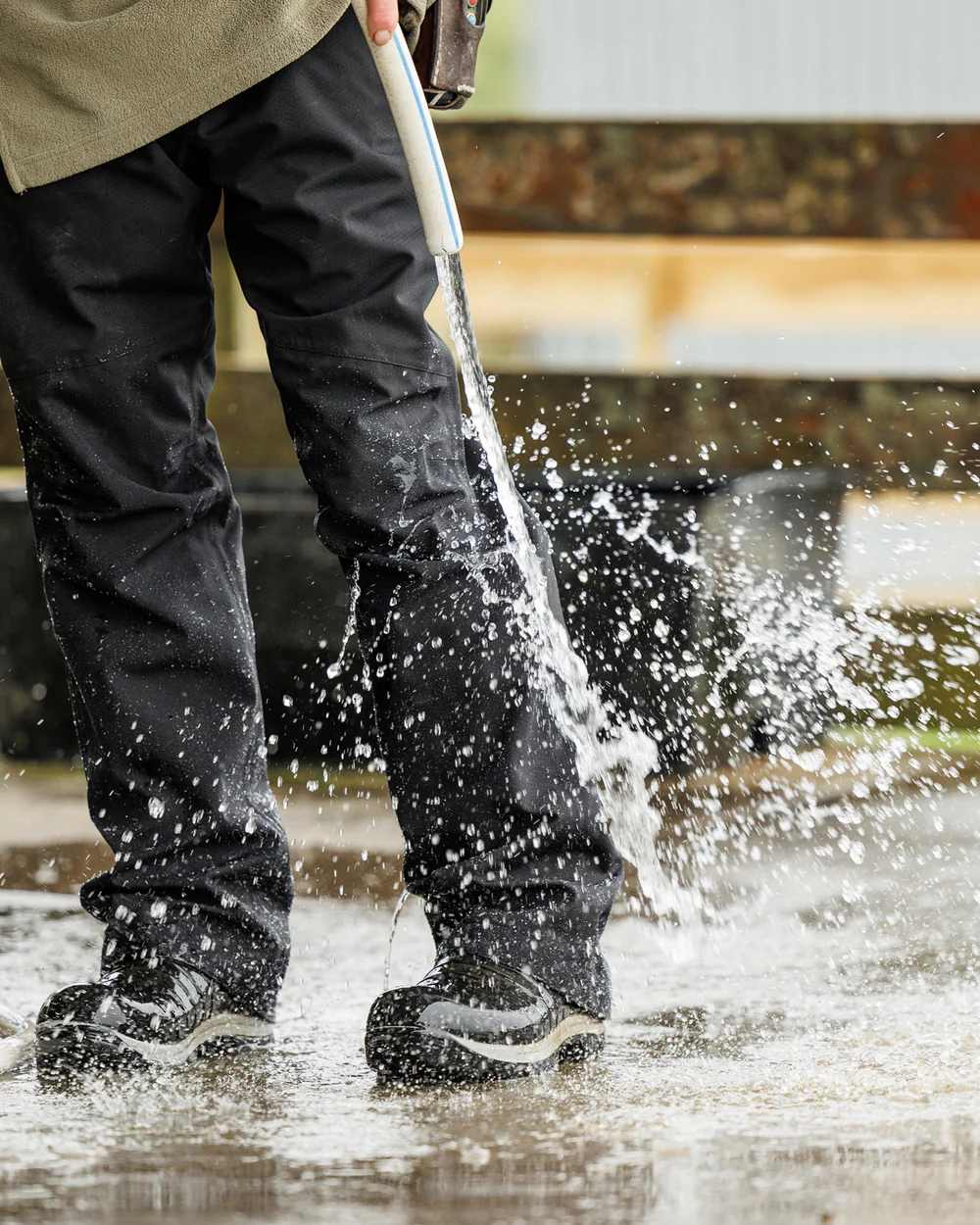 Black Coloured Swazi Torrent Overpants on water background 