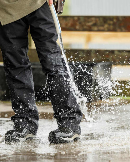 Black Coloured Swazi Torrent Overpants on water background 