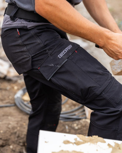 Black coloured TuffStuff Evo Flex Trousers on outdoor background 