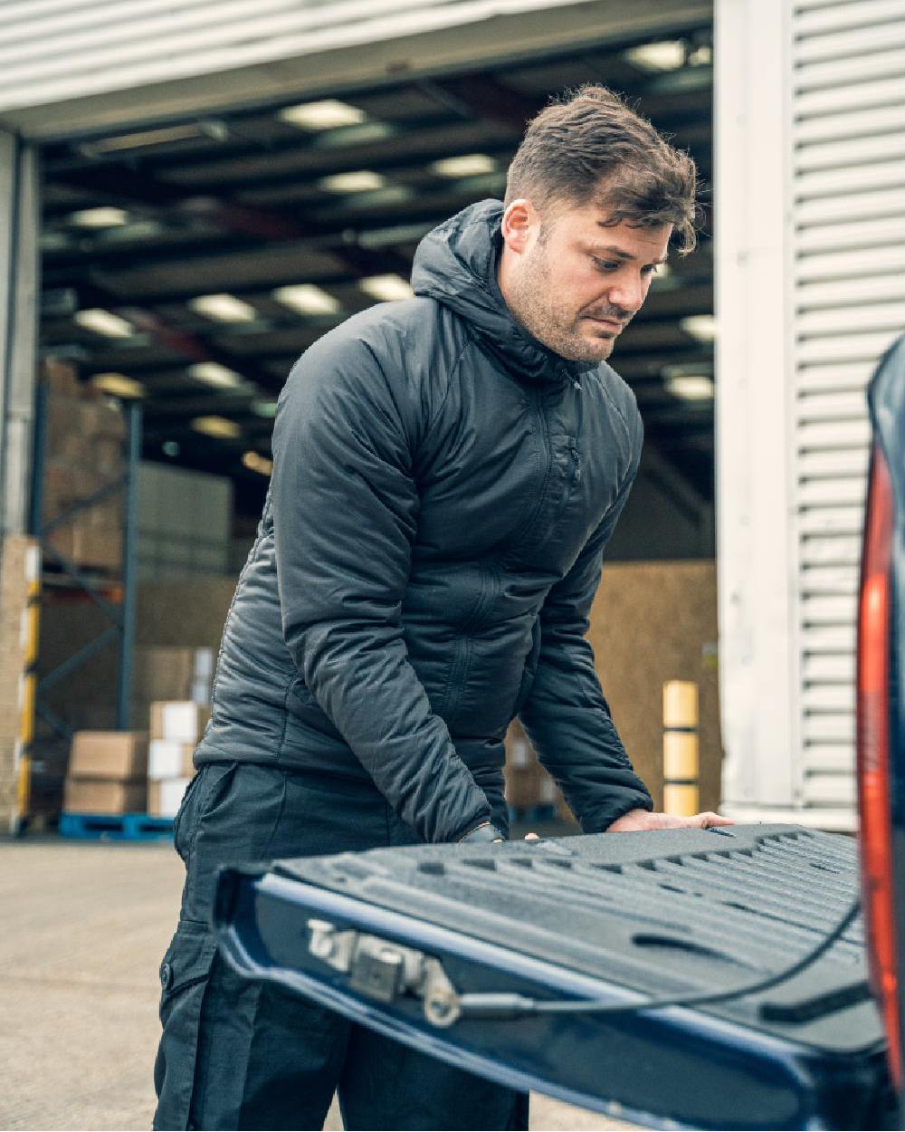 Black Coloured Viper Frontier Jacket on warehouse background 