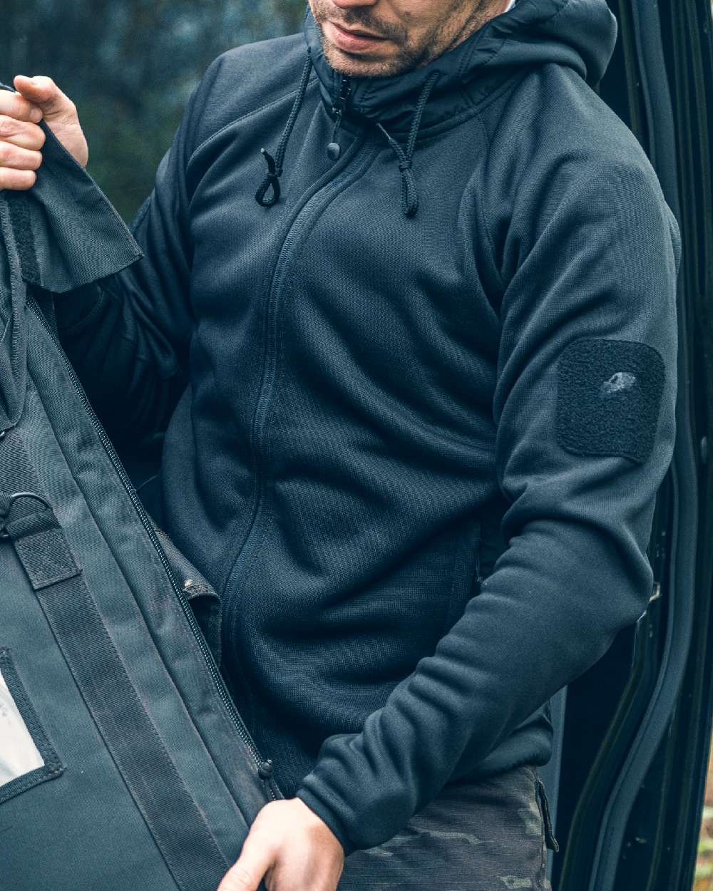 Black coloured Viper Storm Hoodie on blurry background 
