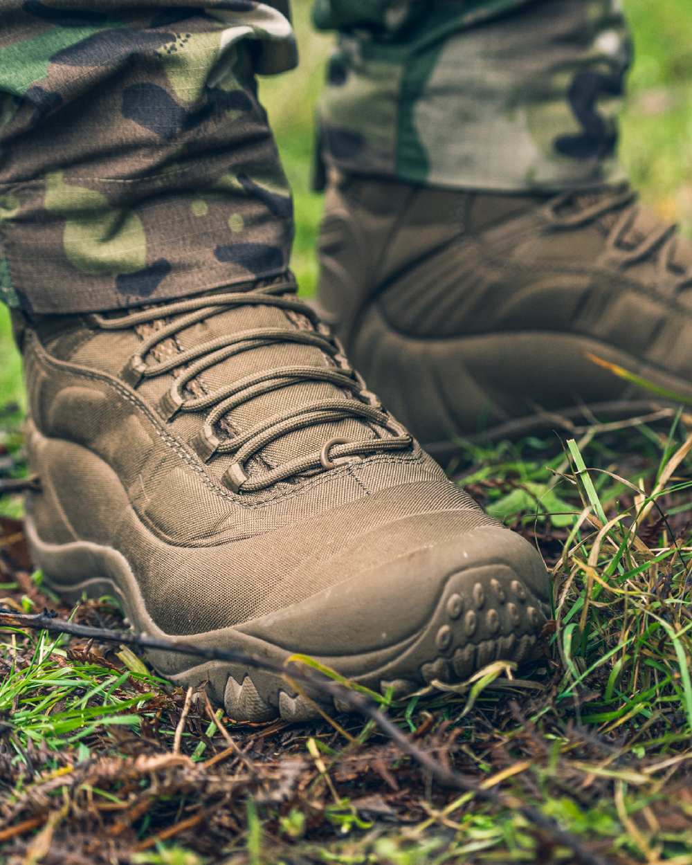 Coyote Coloured Viper Venom Boots on land background 