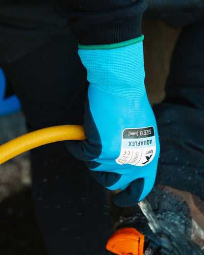 Blue Black coloured Xpert Core Aquaflex Waterproof Fully Coated Gloves on blurry background 