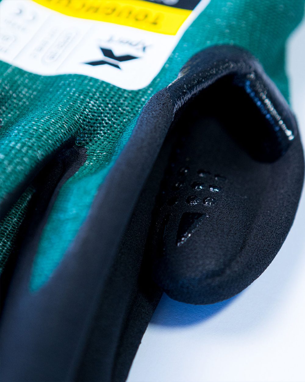 Green Black coloured Xpert Core Toughcut Level C Cut Resistant Dexterous Gloves on white background 