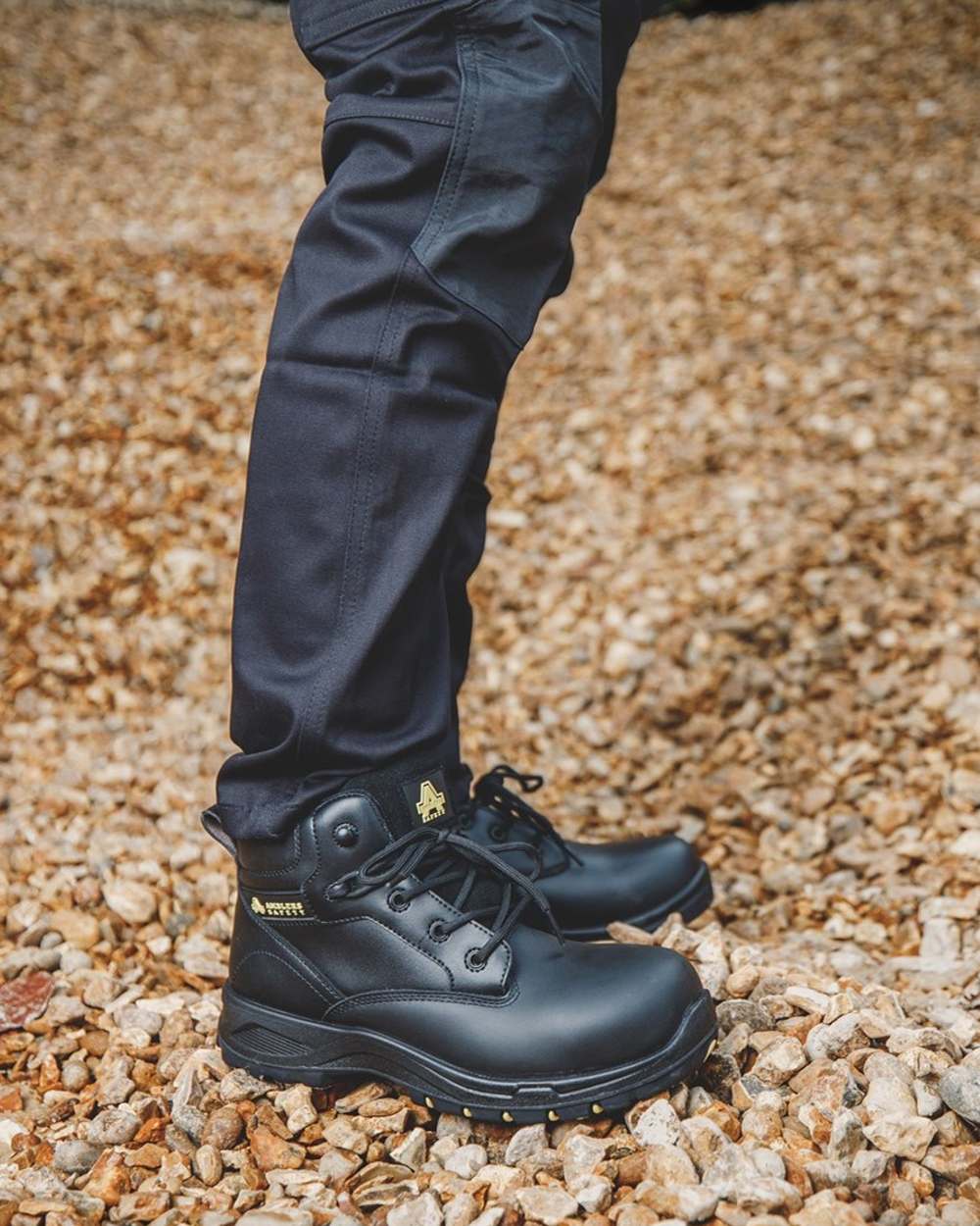 Black Coloured Amblers Safety AS605C Safety Boots on outdoor background