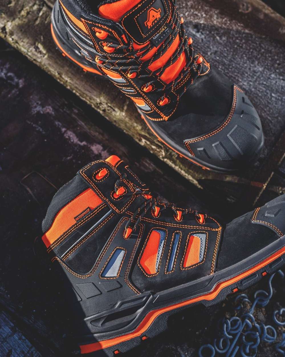 Orange Coloured Amblers Safety Mens AS971C Radiant Safety Boots on a blurry background