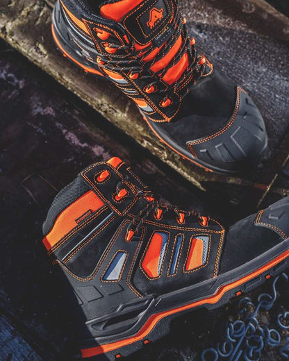 Orange Coloured Amblers Safety Mens AS971C Radiant Safety Boots on a blurry background 